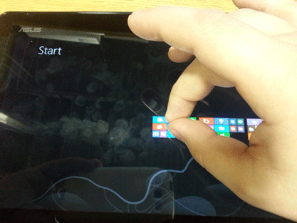 Windows 8 Tablet, Thumb and Finger Pinched Together